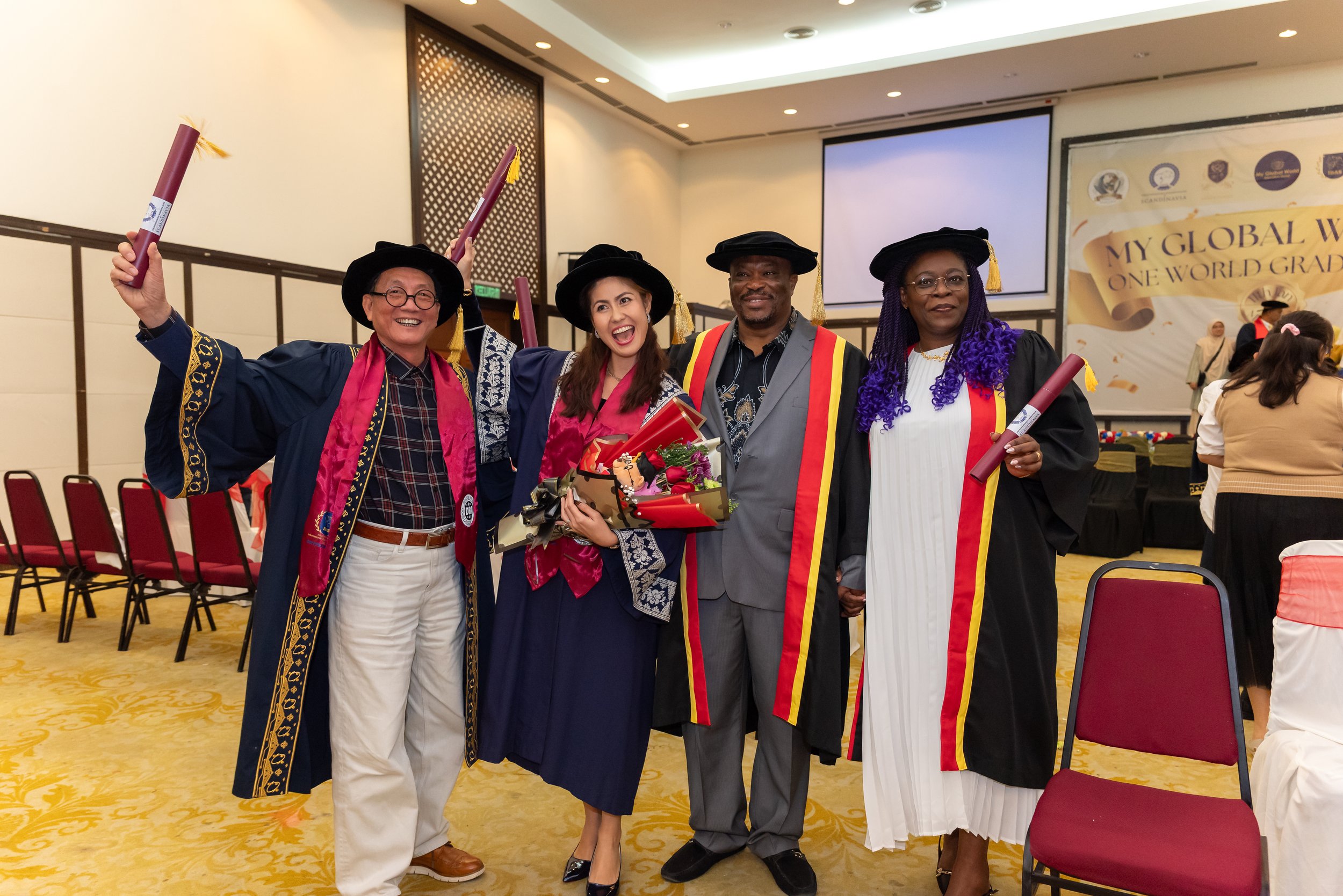 Graduates with diplomas